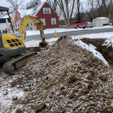 Excavator at a roadside dig